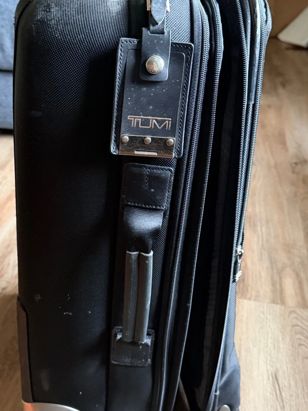Tumi Black Rolling Suitcase with Front Pocket